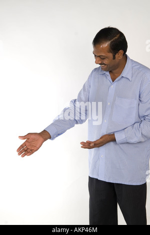 Indian man pointing to the side Stock Photo