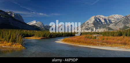 Bow River and Three Sisters Mountains at Exshaw cement plant Panorama Canadian Rocky Mountains Alberta Canada Stock Photo