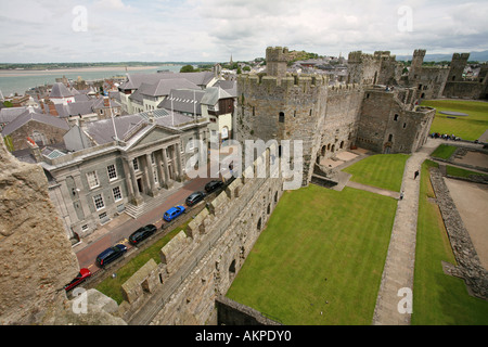 Aerial view of historical Caernarfon Castle with Gwynedd County Hall behind North Wales UK Britain Europe Stock Photo