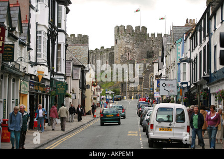 Ancient Conwy castle viewed from main street of Conwy town centre Snowdonia North Wales UK GB Stock Photo