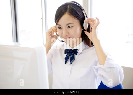 High school girl using a headset Stock Photo