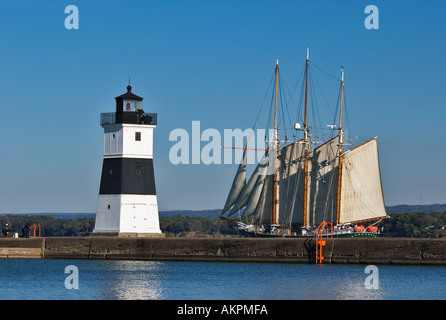 Three Masted Sailing Ship Sailing Past Erie Pierhead Lighthouse Lake Erie Presque Isle State Park Erie Pennsylvania Stock Photo