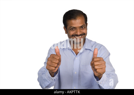 Mature Indian man thumbs up Stock Photo