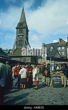 HONFLEUR NORMANDY FRANCE April Shoppers at the busy weekly Saturday market at the Place St Catherine Stock Photo