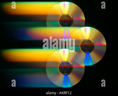 three CD ROM discs in motion with  color Stock Photo