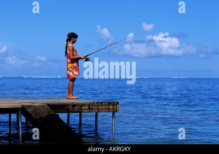 France, French Polynesia, Society archipelago, Leeward islands, Tahaa island, young girl fishing Stock Photo