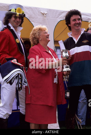 Cynthia Payne presenting prizes to the winning rider at Llanwrytyd Wells Man versus Horse event 2005 Stock Photo