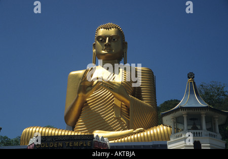 Golden Buddha at the entrance to the Dambulla Cave Temples, Dambulla, near Sigiriya, Matale, Sri Lanka Stock Photo