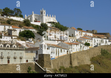 Portugal the Alentejo district, Mértola, view of mediaeval town church clock tower and city walls Stock Photo