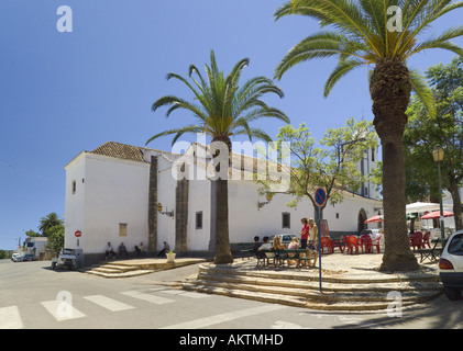 Portugal Algarve, Moncarapacho palm lined village square and church Stock Photo