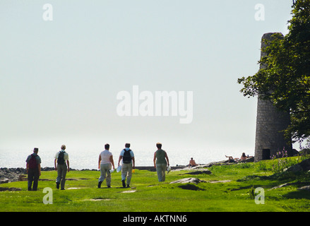 Walkers at Jenny Brown's Point near Silverdale Lancashire Stock Photo