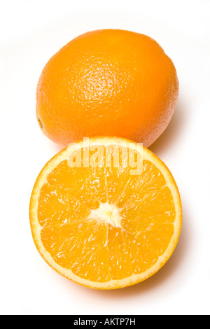 Oranges whole and halved isolated on a white studio background. Stock Photo