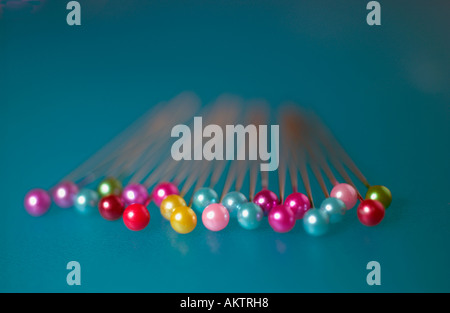 COLORED PINS IN A ROW Stock Photo