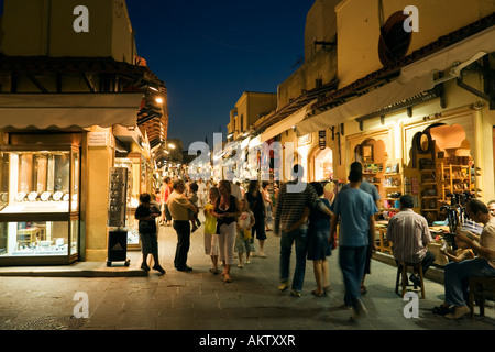 Platia Ippokratou into busy shopping street Odos Sokratous in the evening Rhodes Town Rhodes Greece Stock Photo