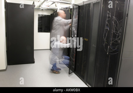Network technician doing preventive work on a network long exposure blurres person Stock Photo