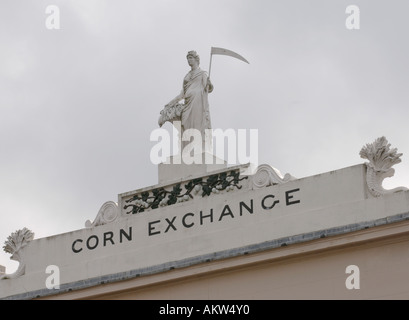 The facade of the old corn exchange originally a Georgian theatre is topped by a statue of Ceres the Roman goddess of cereals Stock Photo