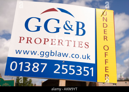Property real estate under offer estate agents sign advertising property for sale UK Stock Photo