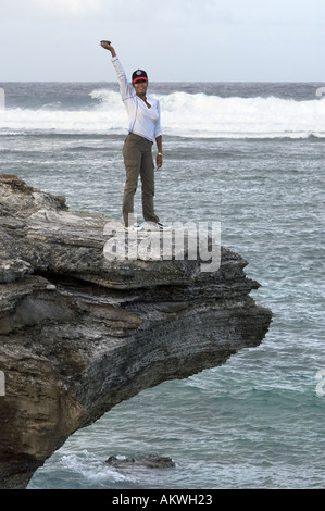 woman standing on cliff top Stock Photo