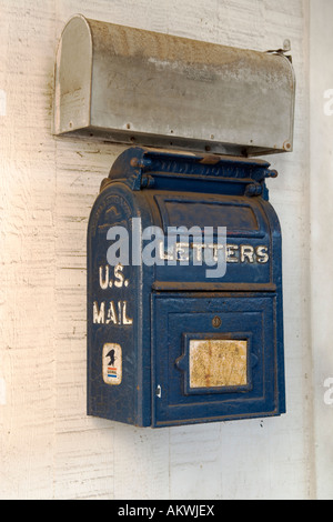 Rural U S mailboxes hanging on wall. Stock Photo