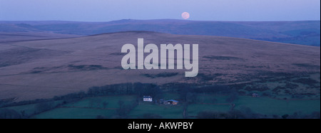 Moon rising over Dartmoor seen from Brentor, Devon, England Stock Photo