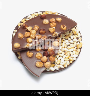Chocolate with nuts and puffed rice, close-up Stock Photo