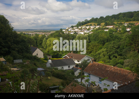 View south over rooftops of houses and gardens in Braunton to Taw Estuary and Westward Ho! in distance Devon England Stock Photo