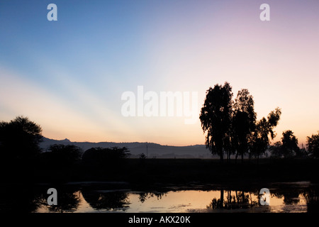 Dawn rays over an indian lake. Andhra Pradesh, India Stock Photo