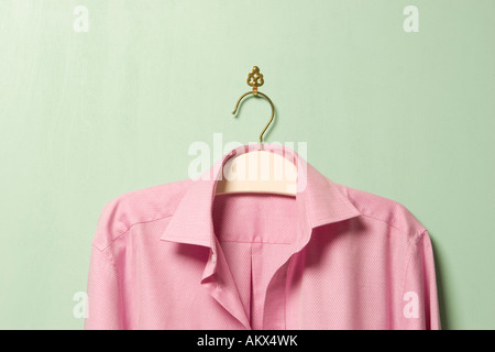 Pink shirt on hanger, close-up Stock Photo