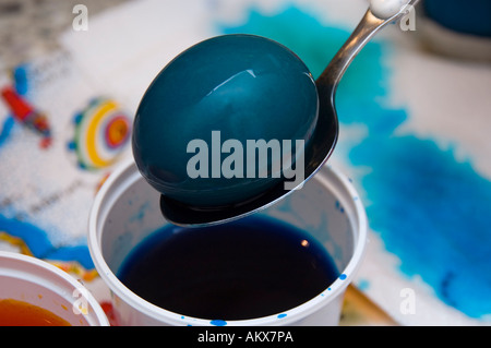 Dyeing/ coloring Easter Eggs Stock Photo