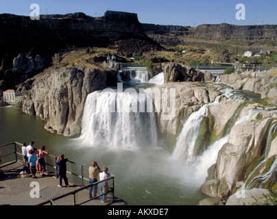 From a lookout point a group of tourists enjoy the impressive view of the plummeting Shoshone Falls, Twin Falls County, ID Stock Photo