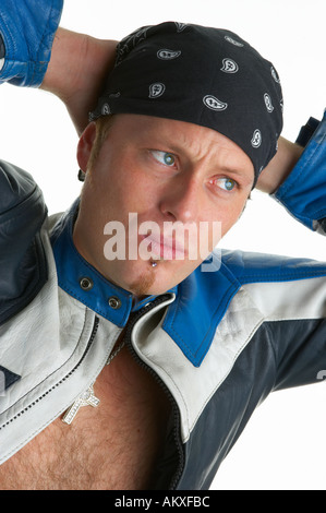 Thirties guy in bandana leathers and cross Stock Photo