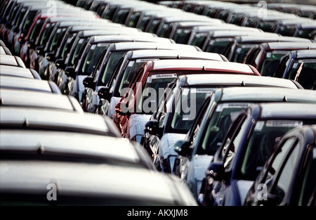 A group of new Ford cars stand in lines as they await shipment from Southampton Docks Hampshire England UK for export abroad Stock Photo