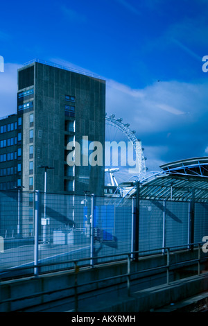 London view as seen from train window with high rise building and London Eye in the distance Stock Photo