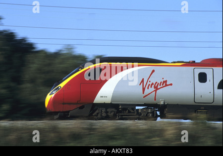 Virgin Pendolino train at speed on West Coast Main Line, Northamptonshire, England, UK Stock Photo