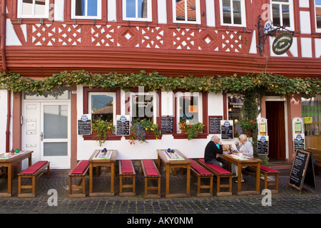 Restaurant with customers in the old part of town, Miltenberg, Bavaria, Germany Stock Photo