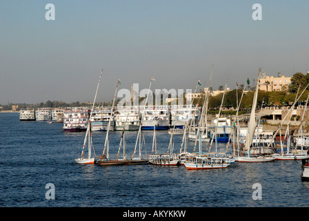 Nile cruise with a cruise liner on the Nile River. Cruise ships and feluccas lie on the bank in Luxor, Egypt Stock Photo