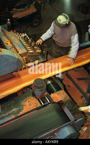 Bench saw operator milling red gum flitches  Koondrook,  Victoria, Australia, vertical, Eucalyptus camaldulensis Stock Photo