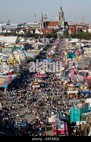 Thousands of people are walking over the Theresienwiese on the Munich Oktoberfest Bavaria Germany Stock Photo