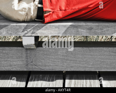 Young Man Lying On Wooden Bench Hudson River Park Manhattan New York City Stock Photo