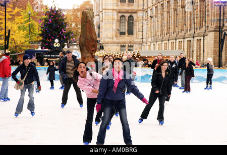 Teenagers Ice skating, Natural History Museum, London England UK Stock Photo