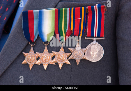 Medals of a British World War 2 veteran proudly worn on his chest during a memorial service Stock Photo