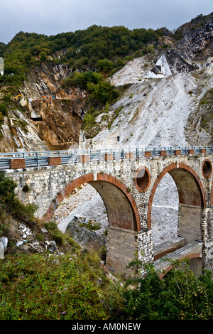 Stone bridge in the marble stone pit of Carrara Tuscany Italy Stock Photo
