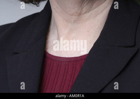 A woman messaging a sore spot on her body. Stock Photo