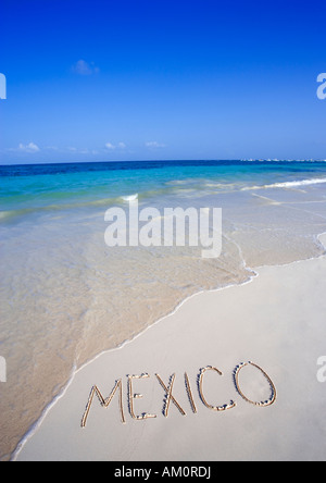 The word MEXICO written on white tropical beach in Playa del Carmen, Cancun, Mexico Stock Photo