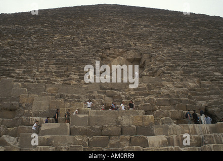 Tourists clamber on the great pyramid, Giza, Egypt Stock Photo