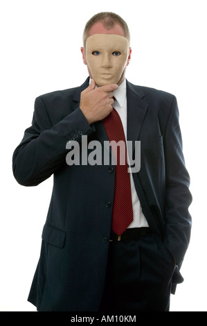 Businessman hiding his identity behind a face mask Stock Photo