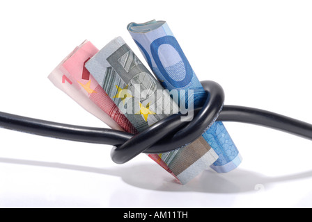 Bills in the knot of a power cable Stock Photo