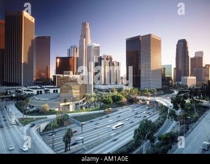 Downtown Los Angles with freeway traffic at sunset Stock Photo