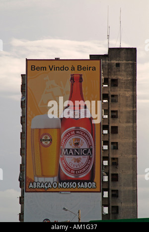 City advertising for Manica beer on the side of an apartment block in Beira, Mozambique. Stock Photo