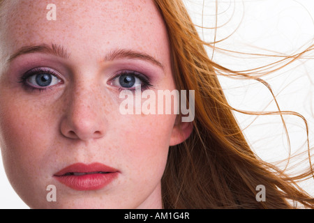 Portrait of a girl with red hair and freckles Stock Photo